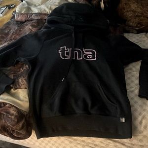 Black TNA hoodie, good condition